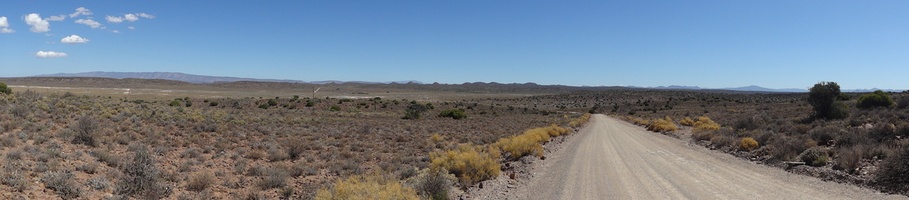 Panorama view of the Karoo with the road winding its way into the distance_180