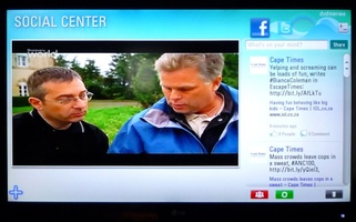 Social Center app showing Facebook feed alongside the TV display