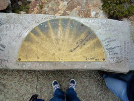 Direction plaque at the lighthouse.... and graffitti