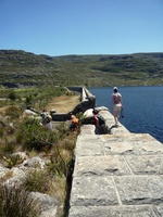 Walking along the wall on the Hely-Hutchinson Reservoir on Table Mountain