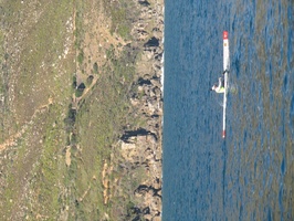 Canoeist in Hout Bay with East Fort in Background