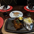 Rump Steak with baked potato and a great South African red wine at Godfathers