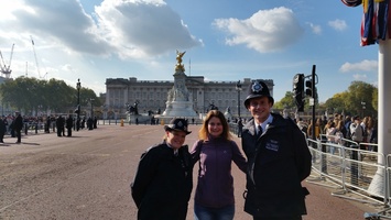 Chnatel with some Bobbies in front of Buckingham Palace