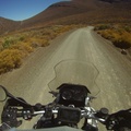 Gravel road twisting and turning through mountains
