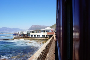 Arriving at Kalk Bay Station with Brass Bell Pub on the sea