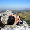 Danie cooling off on top of Eagle's Nest with Muizenberg in background