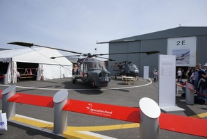 Super Lynx 300 helicopter in foreground and the Wasp in the background