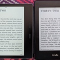 Kindle Oasis on left with Paperwhite on right